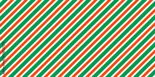 Christmas seamless pattern. Red and green diagonal stripes background. Candy cane repeating decoration wallpaper. Winter holiday lines backdrop. Xmas peppermint present wrapping print design. Vector