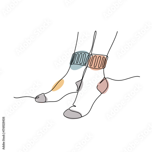 Cozy socked feet with colorful ankle bracelets in a minimalist style  