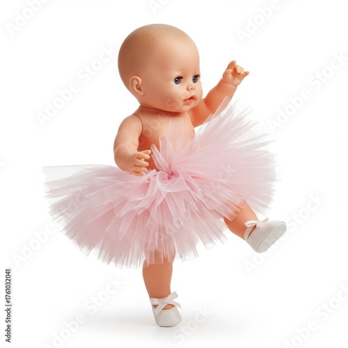 Smiling baby doll in light pink tutu leaning on white wall