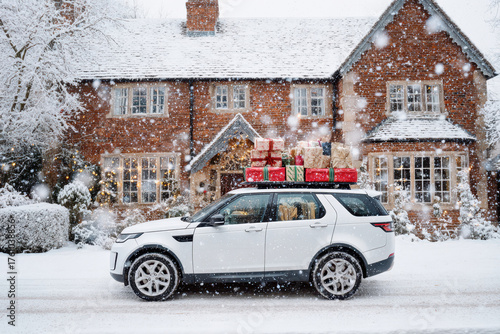 Snowy winter scene with a car carrying holiday gifts outside a home