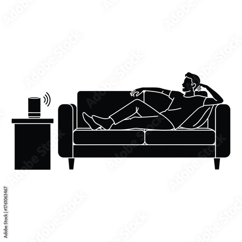 Man relaxing on sofa interacting with smart speaker voice assistant