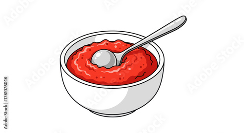 A white bowl filled with vibrant red tomato sauce and a silver spoon.