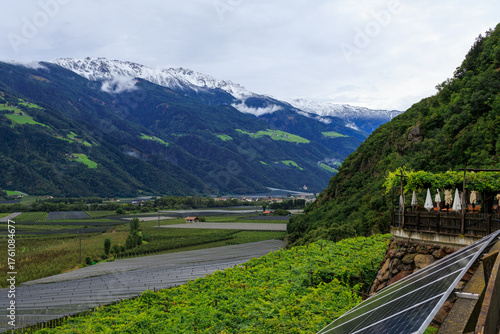 Mountain panorama with snowcapped mountains of Zufrittkamm in Ortler Alps and valley Etschtal on a cloudy day in autumn in South Tyrol, Italy