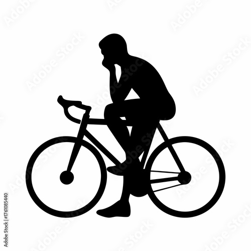 Silhouette of a pensive man on a bicycle in deep thought