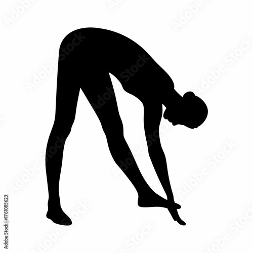 Silhouette of woman in yoga pose stretching legs, head down, forward fold