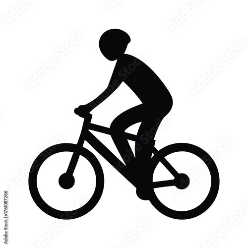 Silhouette of a cyclist wearing a helmet riding a bicycle outdoors