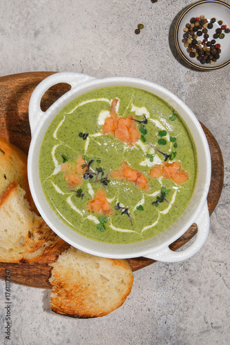 Creamy Green Soup made with Fresh Herbs and accompanied by