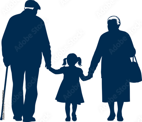 Silhouette of grandparents holding hands with young granddaughter walking together silhouette