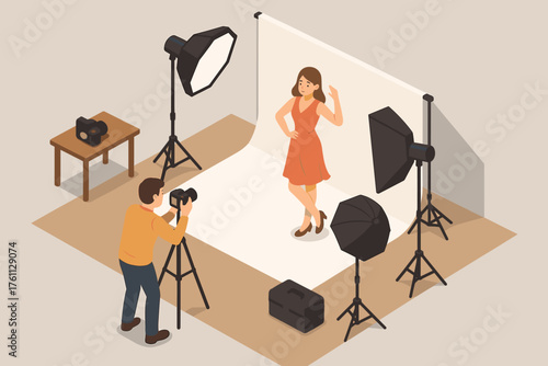Female model posing in photography studio with male photographer and lighting equipment