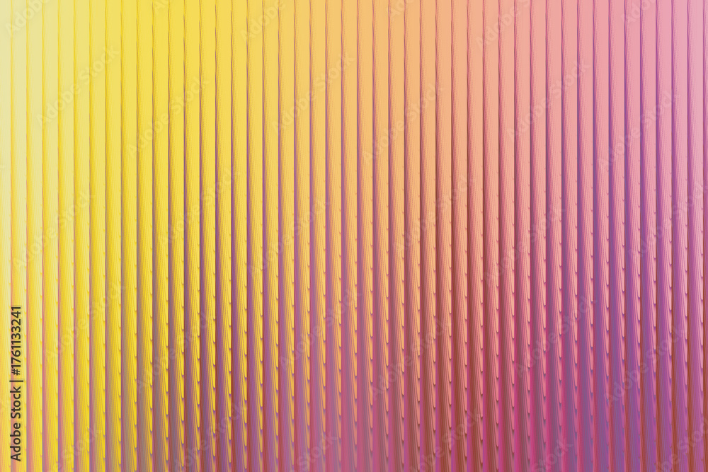 Fototapeta premium A vibrant abstract background featuring a gradient of warm yellow transitioning into soft pink and purple hues, with a textured, ribbed pattern creating a sense of depth