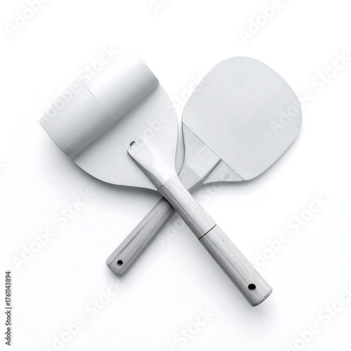 Two crossed white paddles