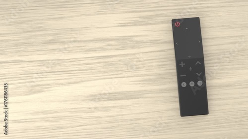 Smart TV remote control on wooden desk, top view