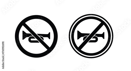 No honking signs depicted in black and white prohibiting vehicle sound signals