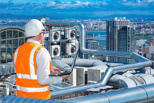 Man inspects ventilation sy...