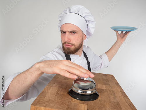 Chef in white uniform and h...