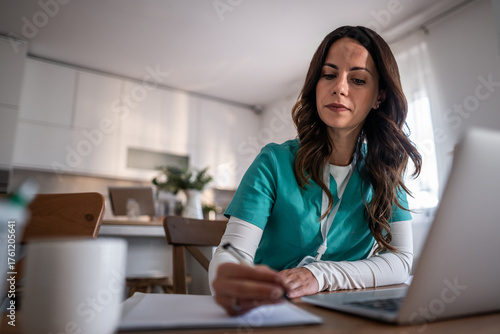 Female healthcare professional studying medicine at home