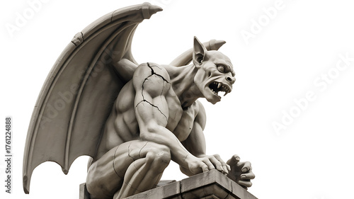 Stone gargoyle with wings perched atop a structure, displaying fierce and mythical creature design.