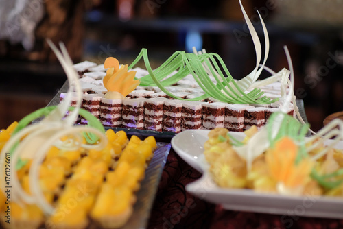 Cakes with sweet, high calorie cream topping are served as snacks.