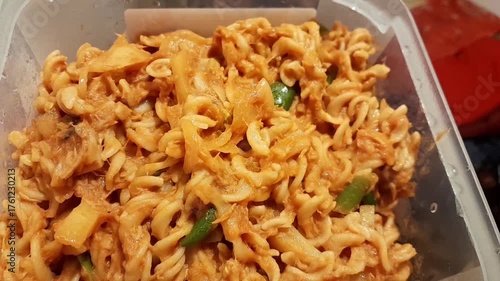 Spiral macaroni Pasta ready for eat. Fusilli pasta with tomato creamy sauces, tonno, green chilli, and olive oil.  