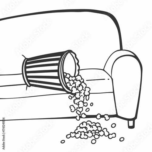 Spilled popcorn from trash can on couch in a living room setting  