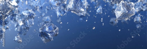 Floating Ice Crystals Sparkle in a Deep Blue Background, Creating a Magical Winter Scene Filled With Light and Reflections
