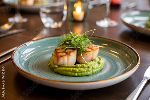 Seared Scallop with Green Puree and Microgreens on Ceramic Plate – Gourmet Fine Dining Presentation in Elegant Restaurant Setting