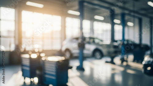 Wallpaper Mural Blurred interior of a bright vehicle repair shop with cars on lifts, filled with natural light reflecting off metal tools and surfaces, creating a clean and dynamic automotive workspace atmosphere. Torontodigital.ca