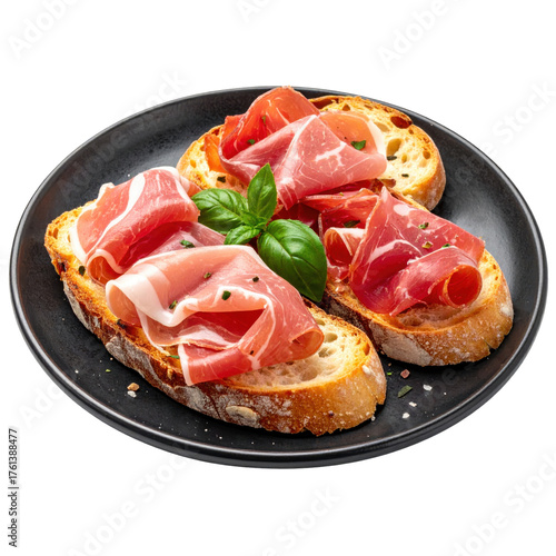 Delicious prosciutto and basil bruschetta on black plate isolated on white