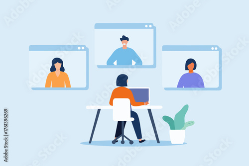 Woman participating in a video conference call with colleagues from her home office