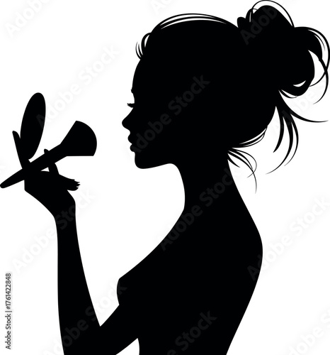 Woman applying makeup with brush and compact silhouette
