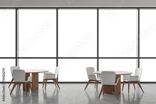 Contemporary interior with round tables and white chairs set against tall transparent windows, on minimalist concrete floor with clean copy space. 3D Rendering