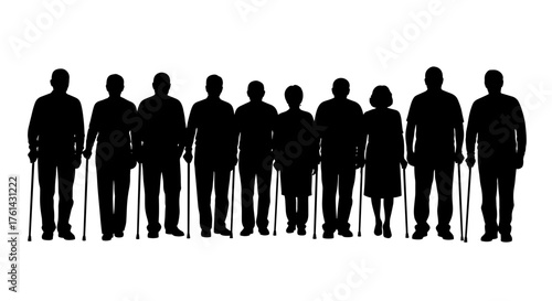 Group of elderly people with canes standing in silhouette  