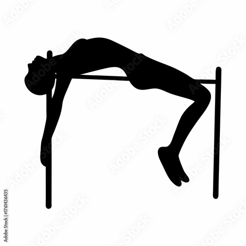 Silhouette of high jumper clearing the bar successfully in intense athletic competition