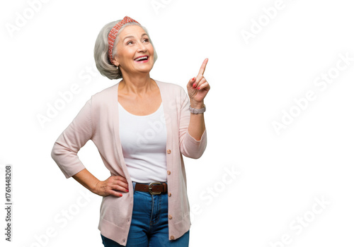 Smiling senior woman pointing up isolated on transparent background