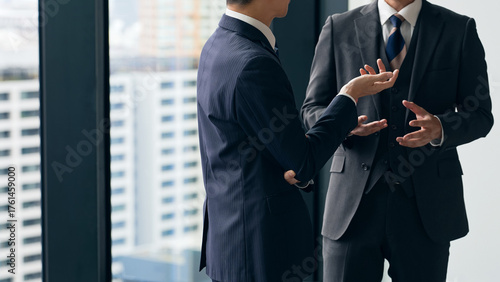 Fotografie A group of business people having a conversation in the lobby