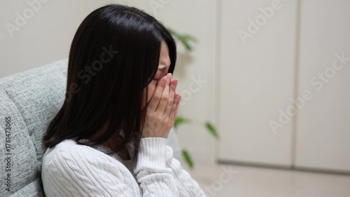 Close-up of a woman coughing