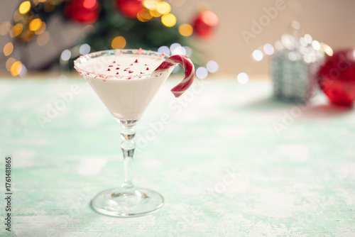 White chocolate  martini cocktail with candy cane. Christmas drink