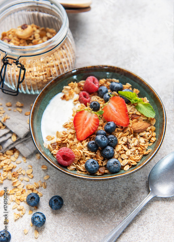 Healthy breakfast granola bowl with fresh berries