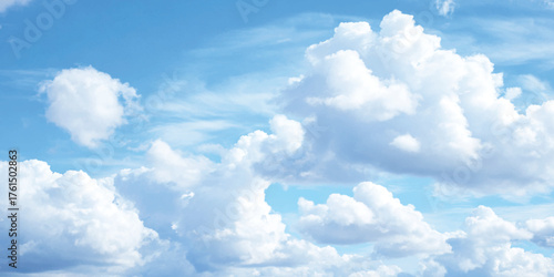 Bright summer day sky filled with beautiful cumulus and cirrus clouds, a perfect background for weather and nature concepts.