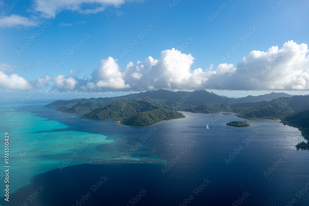 Naklejka premium Aerial view of Tahaa island, French Polynesia, with turquoise lagoon and reef
