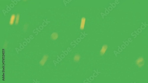 Abstract blurred yellow shapes on a green background 