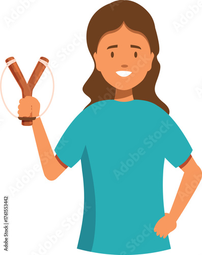 Portrait of a cheerful young woman holding a wooden slingshot, depicting a sense of playful mischief and empowerment