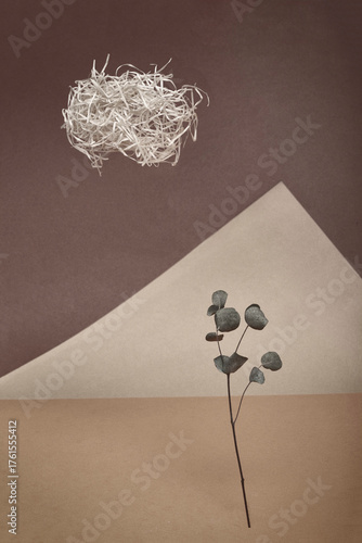 Decoration of sheets of colored paper, wood shavings and branches with dry leaves