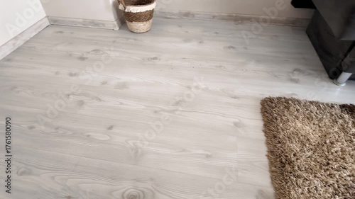 Natural wood laminate parquet floor. Room with laminate in new apartmen. Cozy home interior, modern design