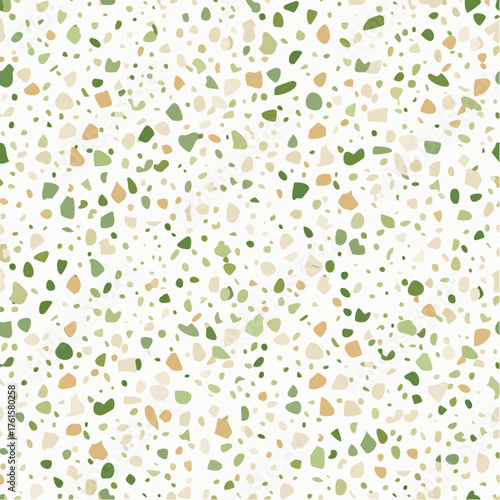 Terrazzo flooring with green and beige chips.