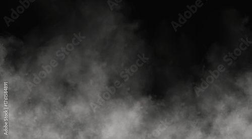 Photos Wisps of white smoke rising against a dark background