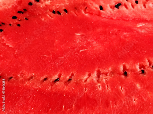 Close-up of the vibrant red flesh of a sliced watermelon.