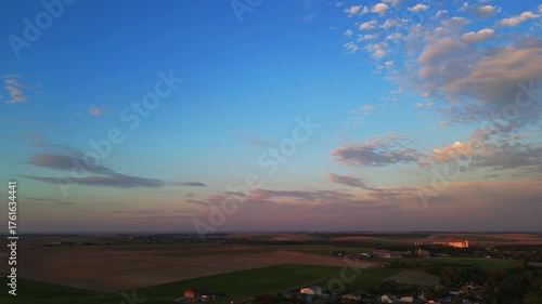 Bergnicourt, Rethel, Ardennes, Grand-Est, France, August, 28th, 2025, A breathtaking view of the stunning sunset illuminating the expansive fields and softly colored clouds around