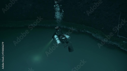 An ethereal image capturing a scuba diver descending toward the infamous hydrogen sulfide cloud layer of Cenote Angelita in the Yucatán.