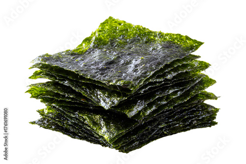 Stack of dried seaweed nori sheets with glossy green texture, isolated on transparent background